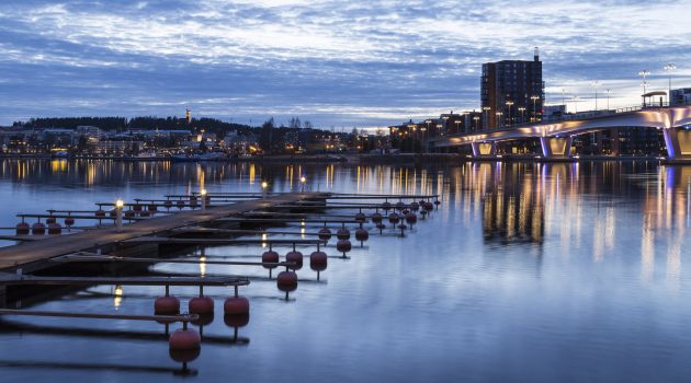 A bridge leading to the city with empty pier in front. Picture is taken in Jyv?skyl?, Finland.