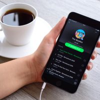 İstanbul, Turkey - January 16, 2016: Woman hands holding an Apple iPhone 6 Plus displaying Spotify application.  iPhone, produced by Apple Computer, Inc.